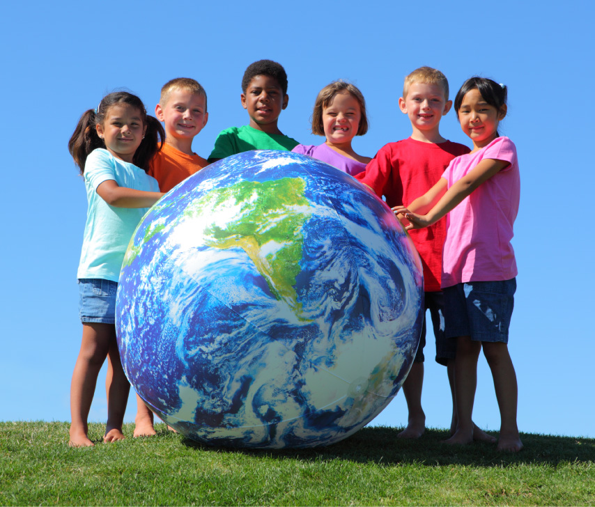 diverse children with large globe