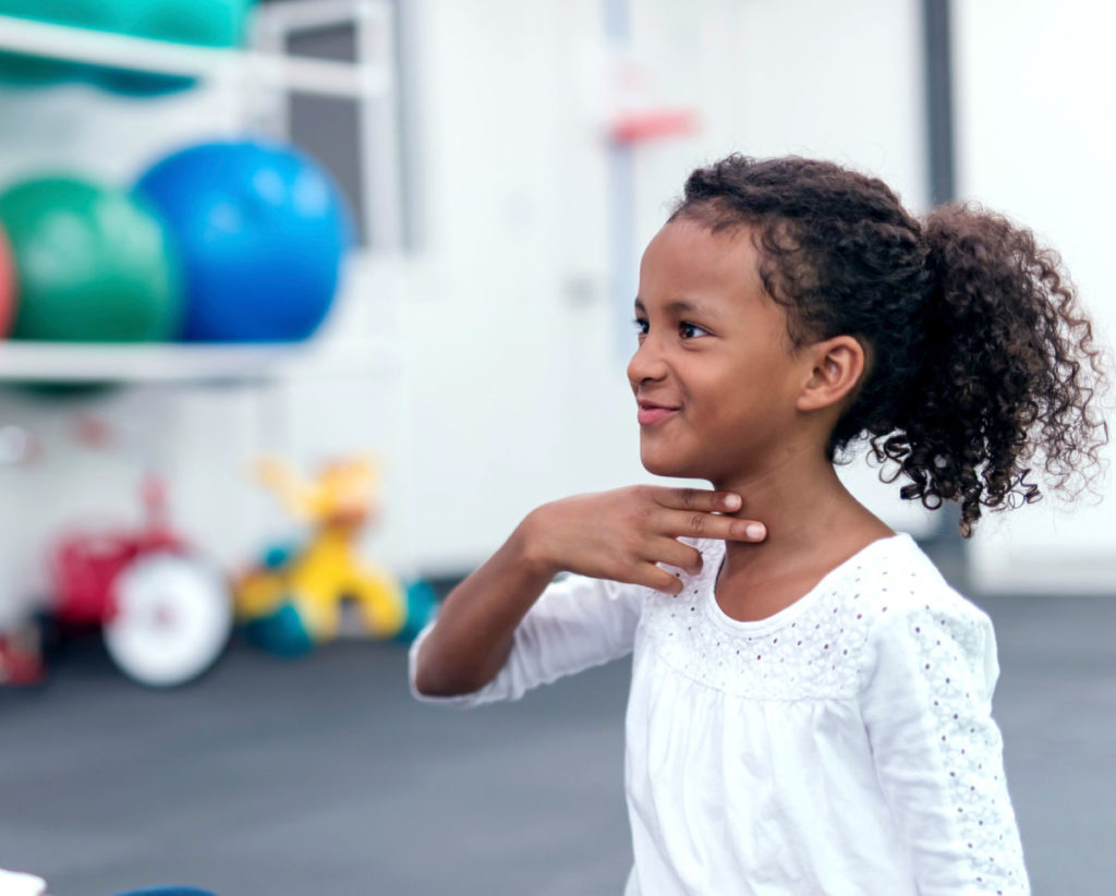 young girl in speech therapy